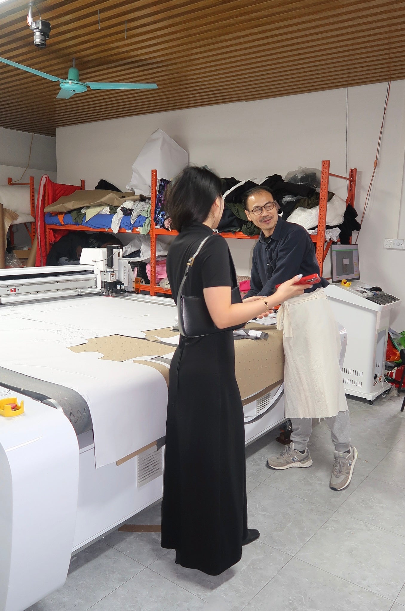 The founder is seen conversing with the pattern maker